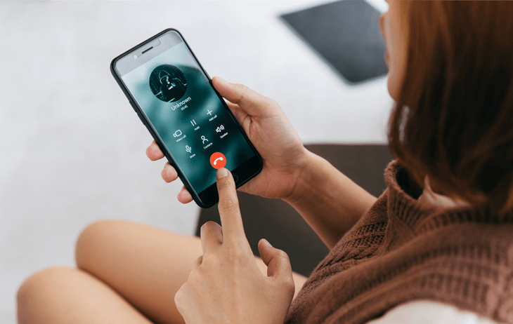 Girl Blocking Someone on Her Phone