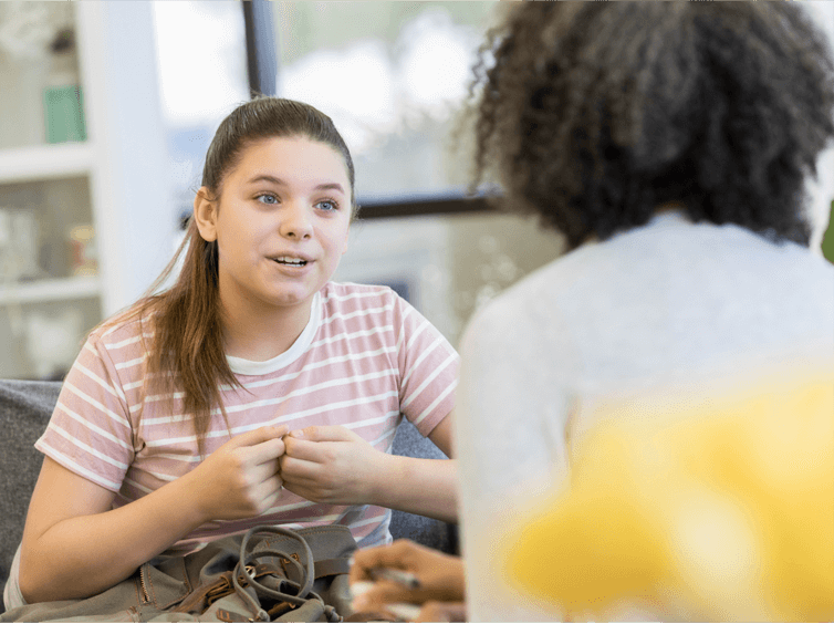 Girl Telling a Trusted Adult