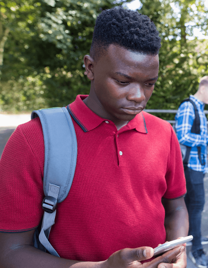 Boy Being Careful Who He Talks To